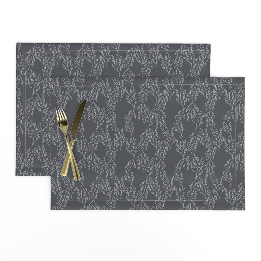 Top down of a set of two Placemats stacked and offset from eachother with a knife and fork on top