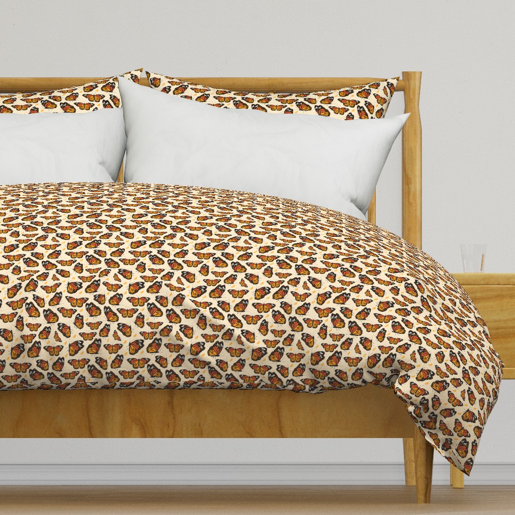 Light colored wooden bed frame with a duvet cover