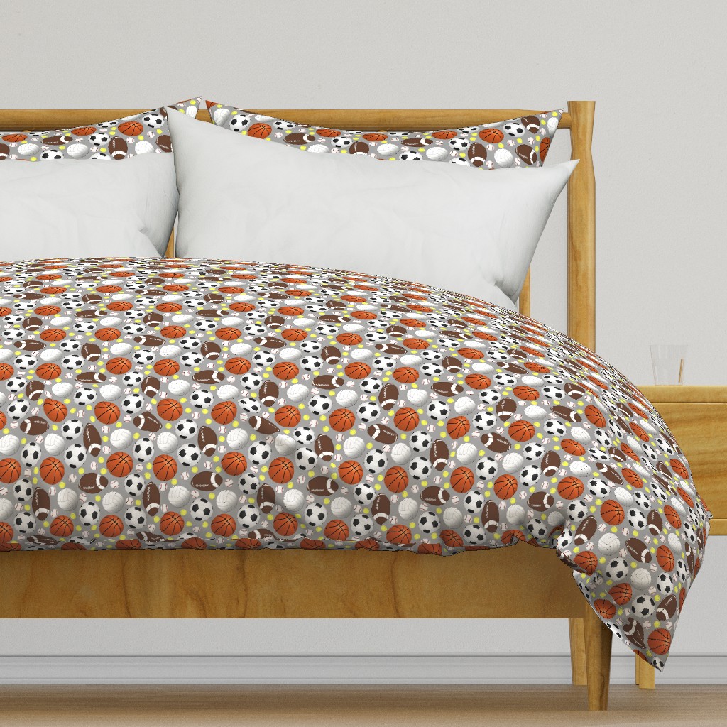 Light colored wooden bed frame with a duvet cover