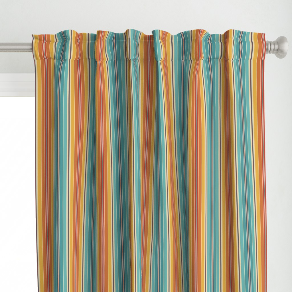 Close up of a Curtain panel hanging from a silver curtain rod in front of a window