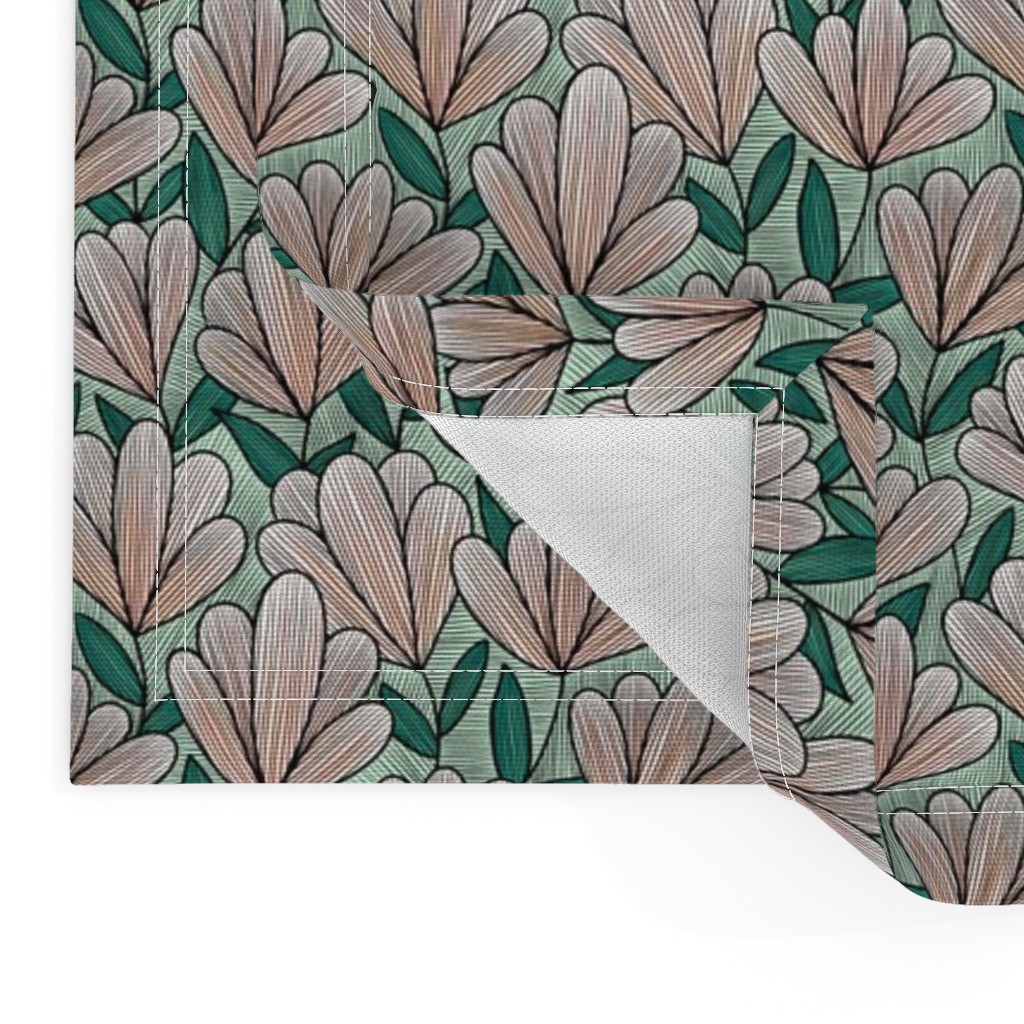 Close up of two Placemats stacked on top of eachother and the top left bottom corner is flipped up showing the hem and unprinted back