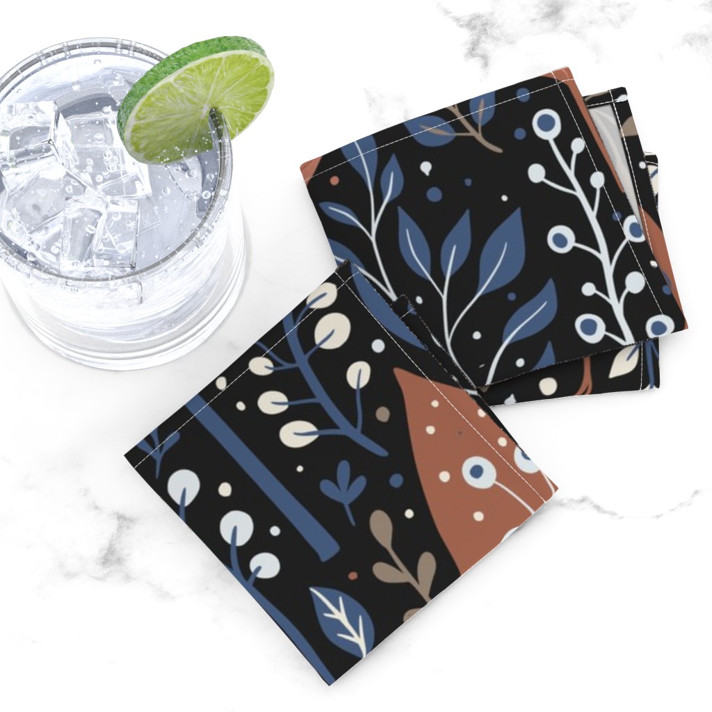 Top down of two folded Cocktail Napkins overlapping next to a glass tumbler full of ice and liquid with a lime wedge on a white marble tabletop