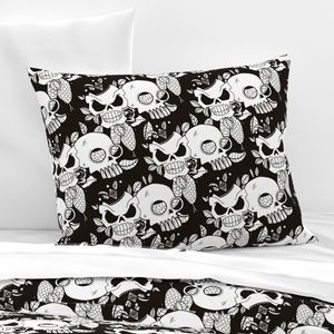 Skulls and snake on black
