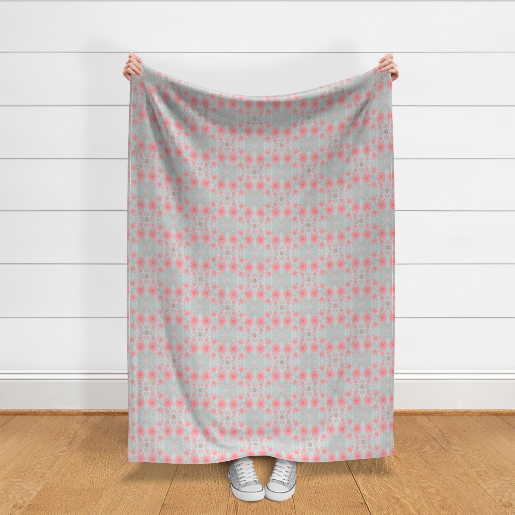 Throw blanket held up in front of a white shiplap wall