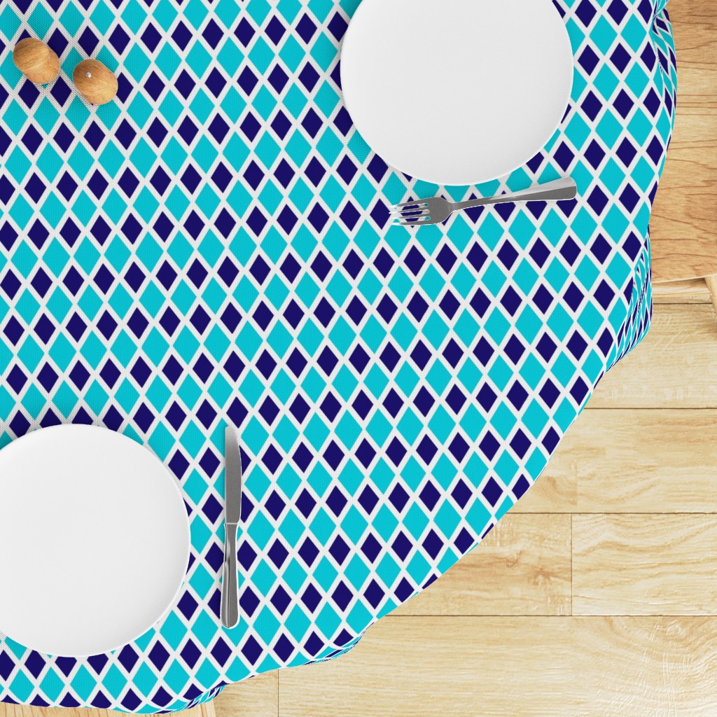 Top down edge of a round table with a Tablecloth draped on top