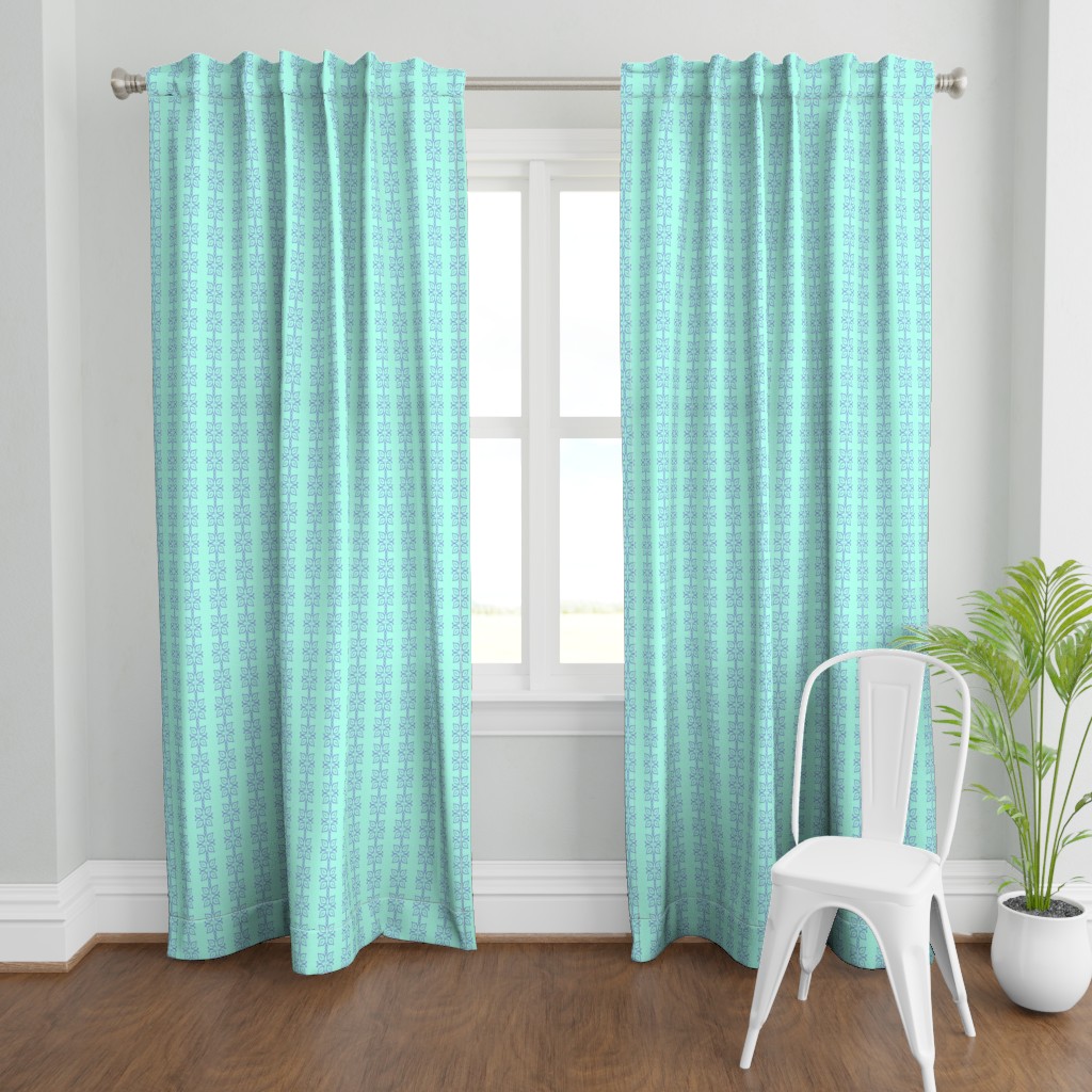 A wide shot with a two Curtain panels hanging from a curtain rod in front of an open window. A plant and a chair are in front and to the right of the right panel.