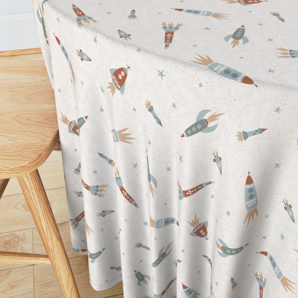 Angeled side view of a round table with wooden chair in the foreground and a 90 inch Tablecloth draped over the edge showing the sewn hem around the edge