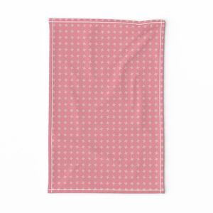 Four leaf geometric ditsy with leaf shapes in light pink on pink background