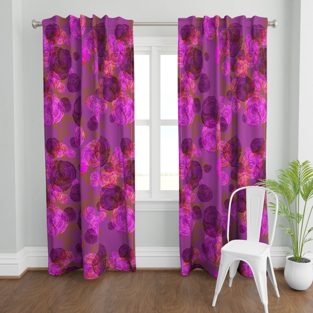A wide shot with a two Curtain panels hanging from a curtain rod in front of an open window. A plant and a chair are in front and to the right of the right panel.