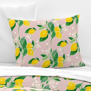 Lemons and lemon blossoms on pink