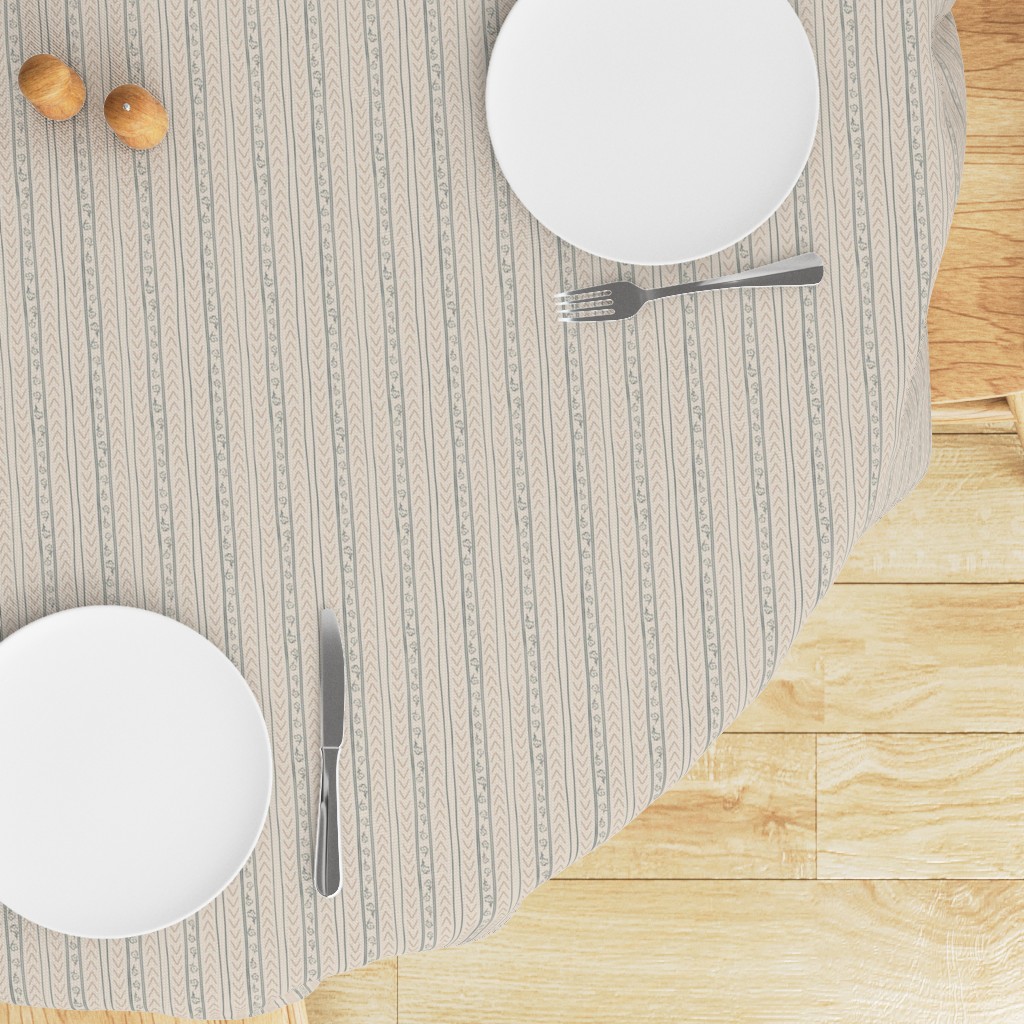 Top down edge of a round table with a Tablecloth draped on top