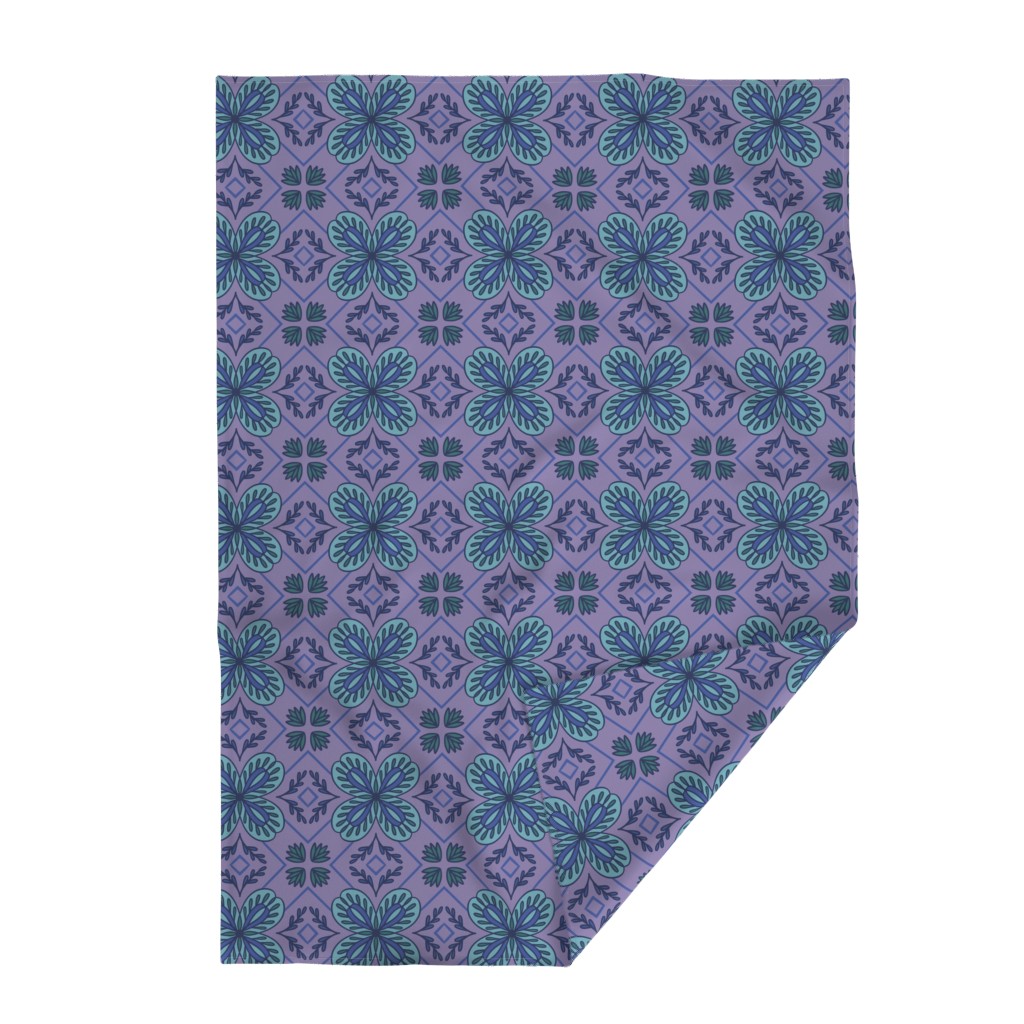Top down Throw Blanket with the bottom right edge flipped up on a white background