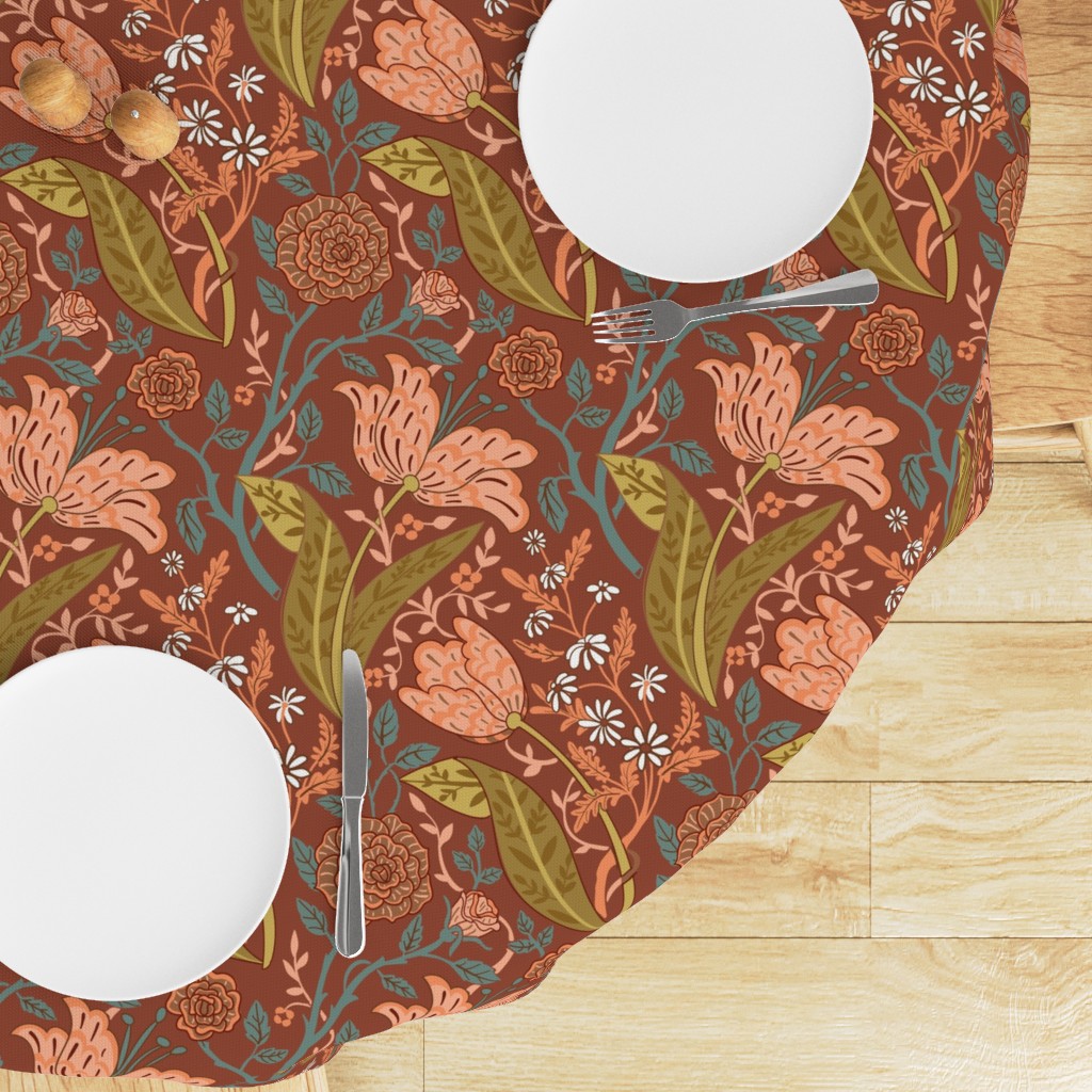 Top down edge of a round table with a Tablecloth draped on top