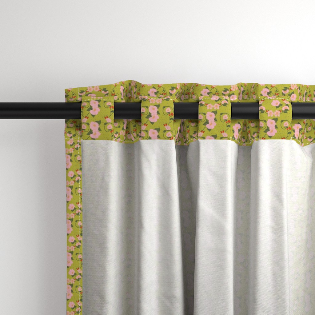 Close up of the back a Curtain panel hanging from a black curtain rod showing the tab hanging option