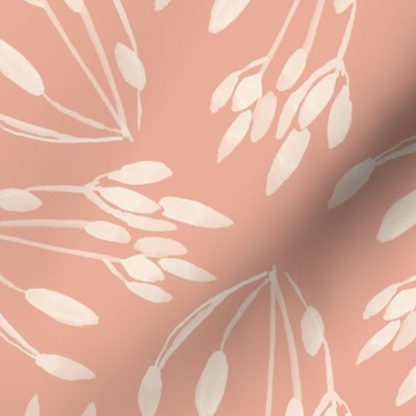 Sprigs of ivory sagebrush on a salmon pink background.