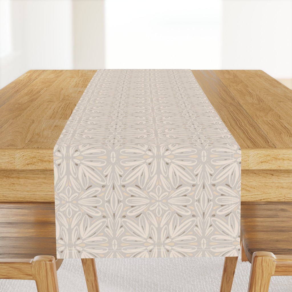 A light wood table with a Table Runner hanging off the front edge