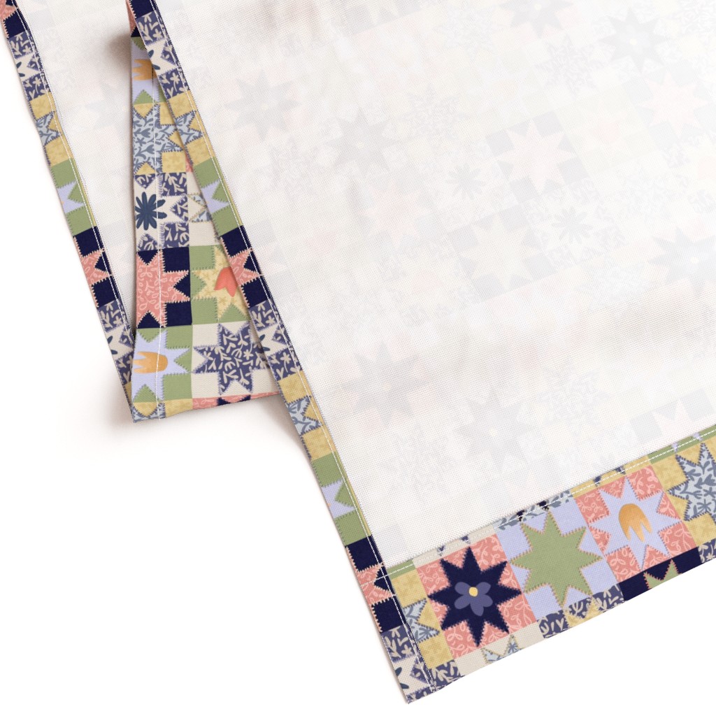 Gently folded Curtain panel laying on a white background showing the unprinted back and large bottom hem