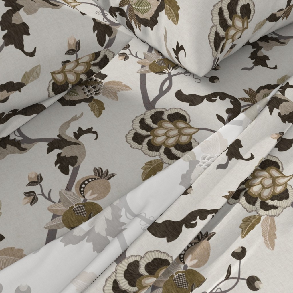 A close-up angled view of a bed with sheets and pillowcases