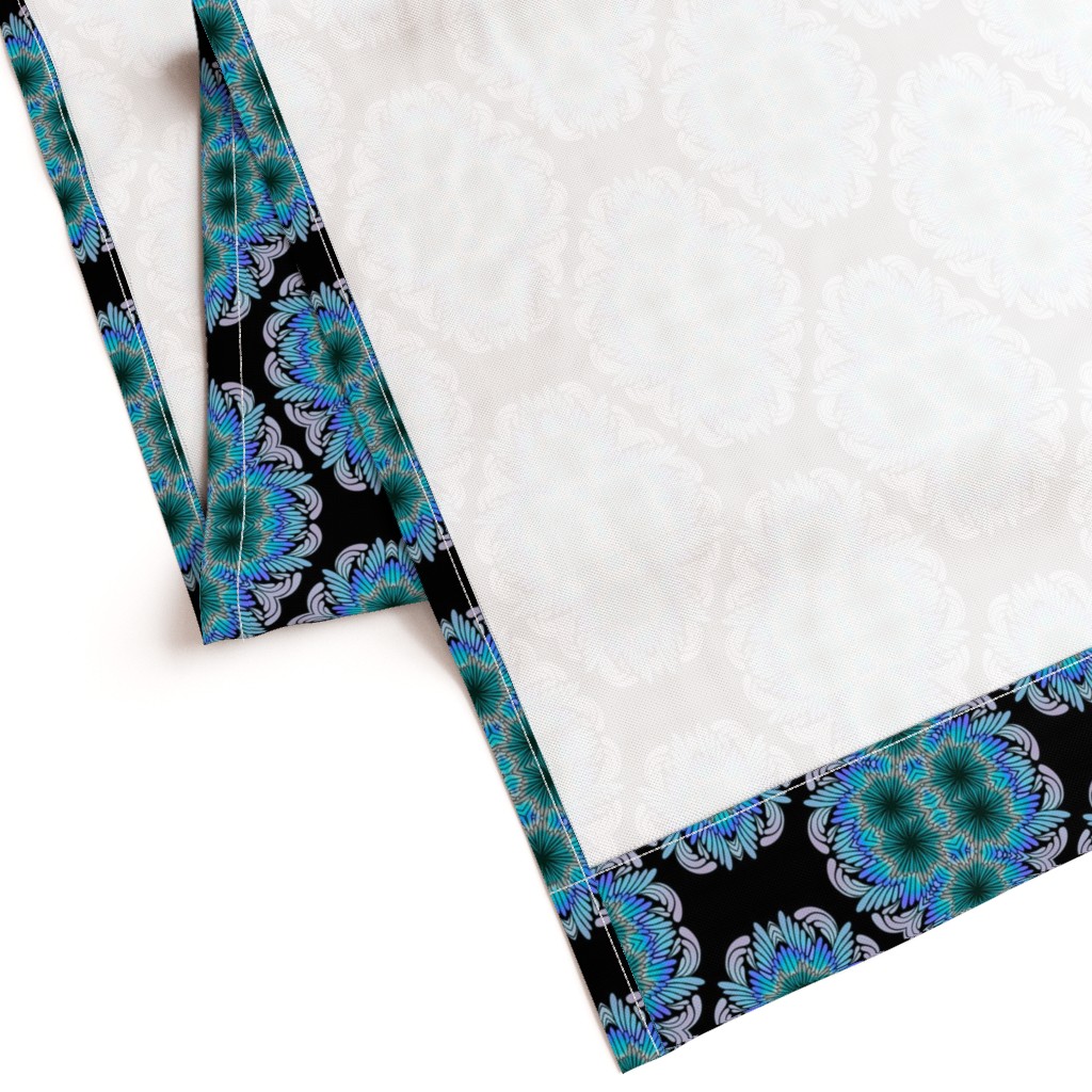 Gently folded Curtain panel laying on a white background showing the unprinted back and large bottom hem