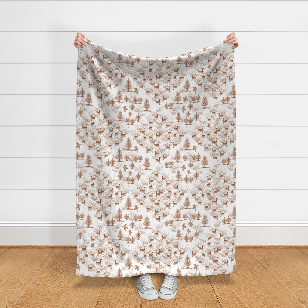 Throw blanket held up in front of a white shiplap wall