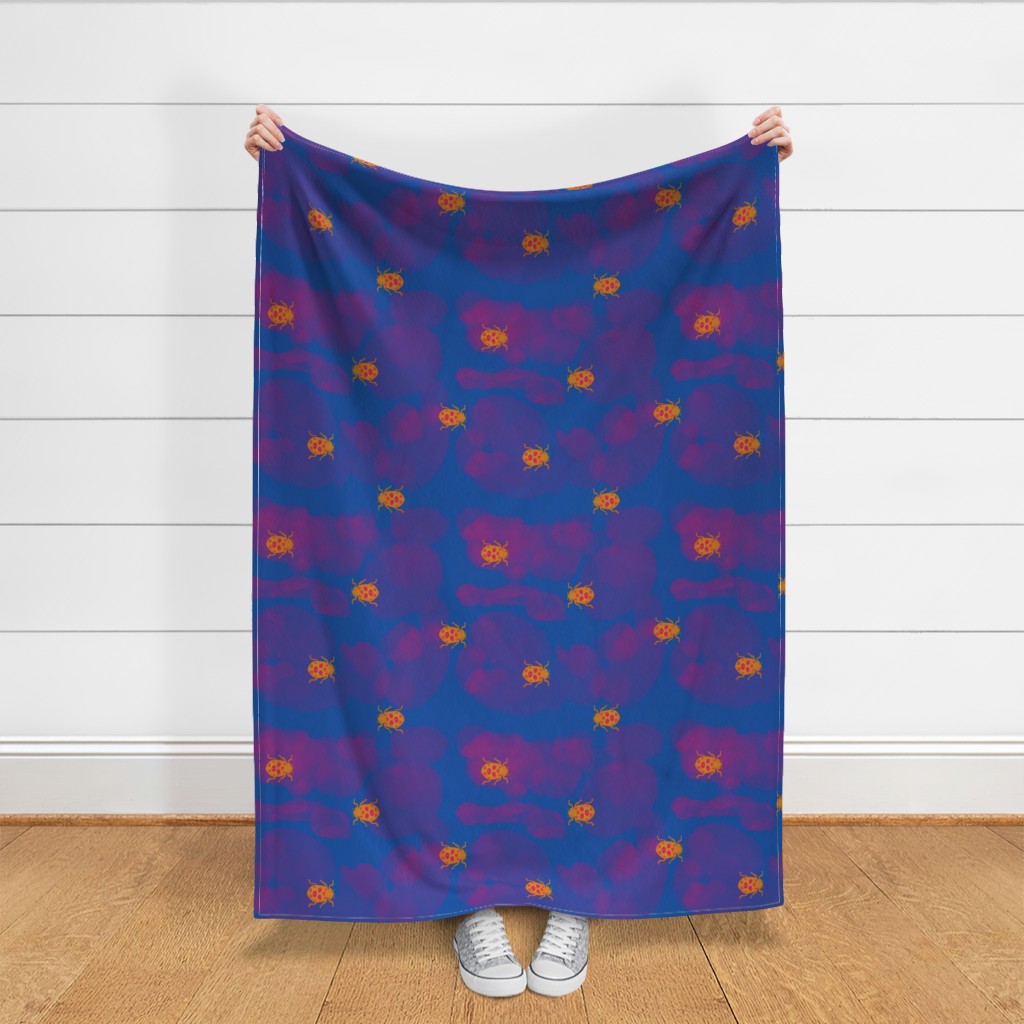 Throw blanket held up in front of a white shiplap wall