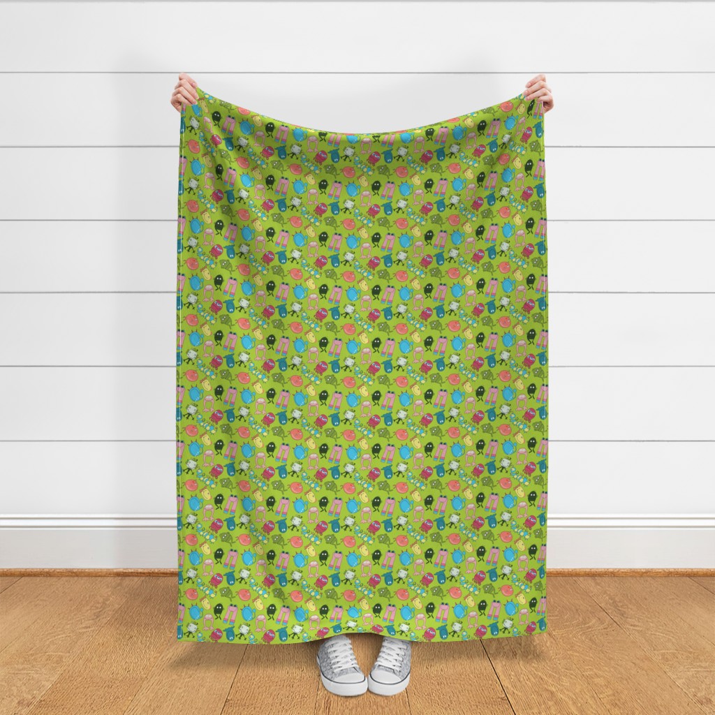 Throw blanket held up in front of a white shiplap wall