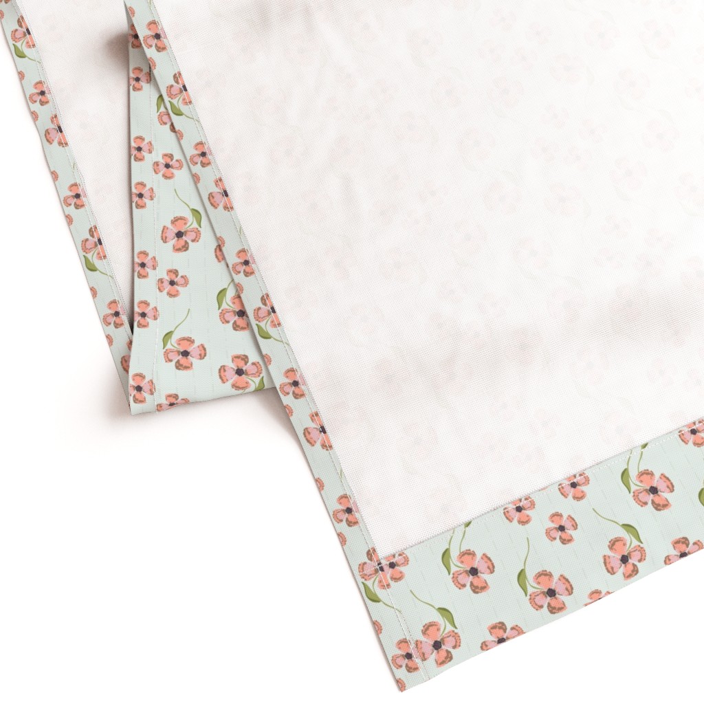 Gently folded Curtain panel laying on a white background showing the unprinted back and large bottom hem