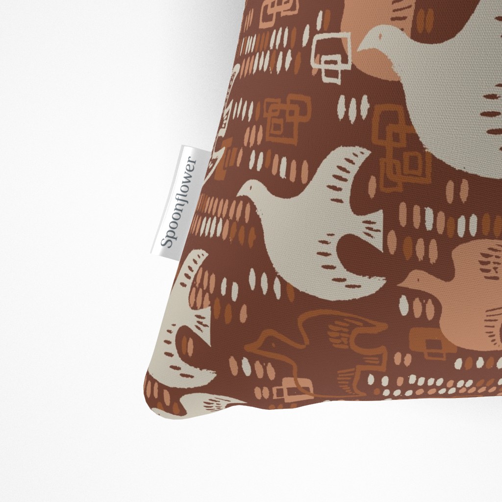 Close up of the Spoonflower tag on the side seam of the Throw Pillow