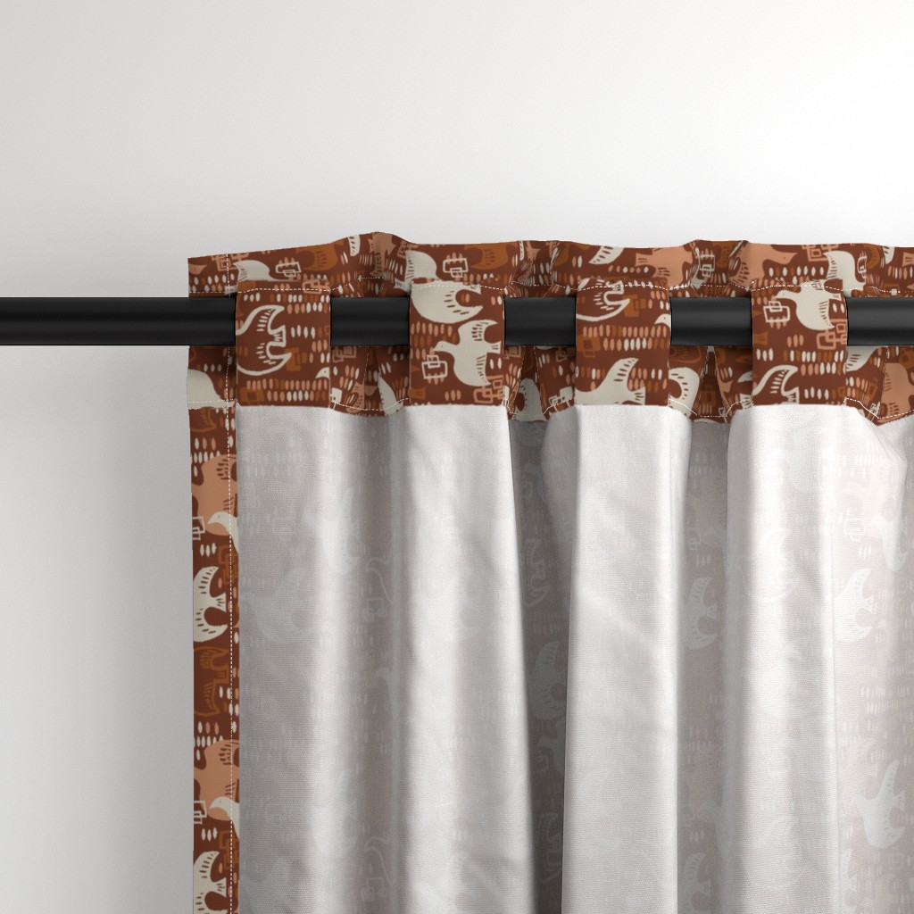 Close up of the back a Curtain panel hanging from a black curtain rod showing the tab hanging option