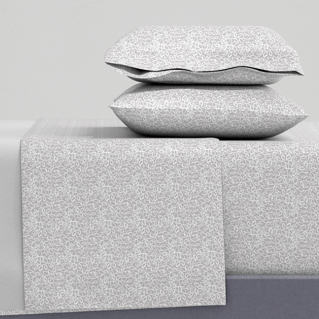 Side view of a bed with sheets and two pillowcases