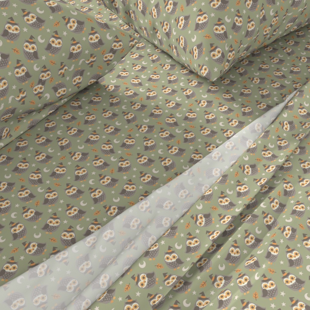 A close-up angled view of a bed with sheets and pillowcases