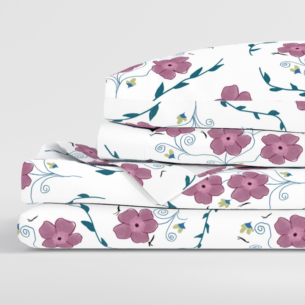 Side view of a folded stack of sheets with two pillowcases
