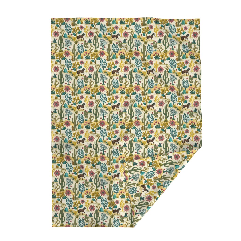 Top down Throw Blanket with the bottom right edge flipped up on a white background
