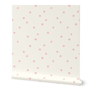 Soft pastel pink polka dots scattered all over on light cream