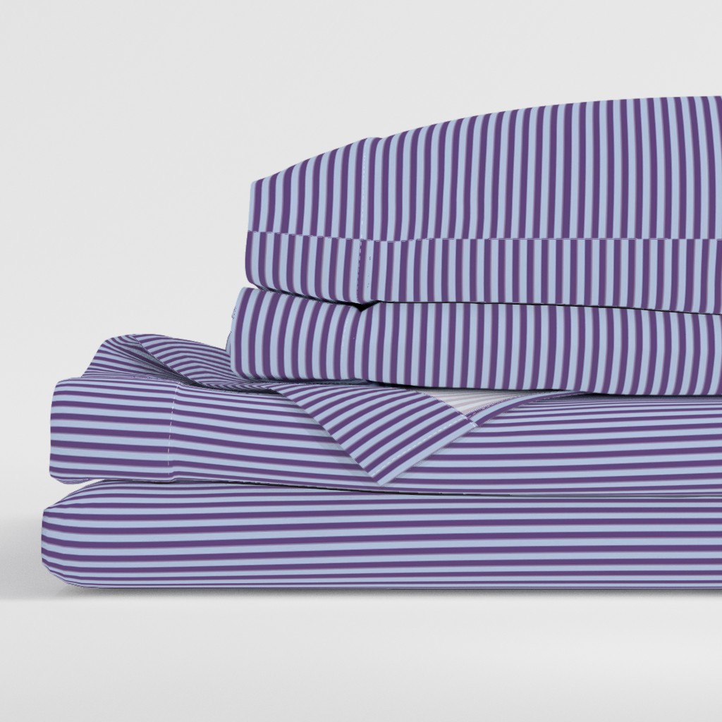 Side view of a folded stack of sheets with two pillowcases