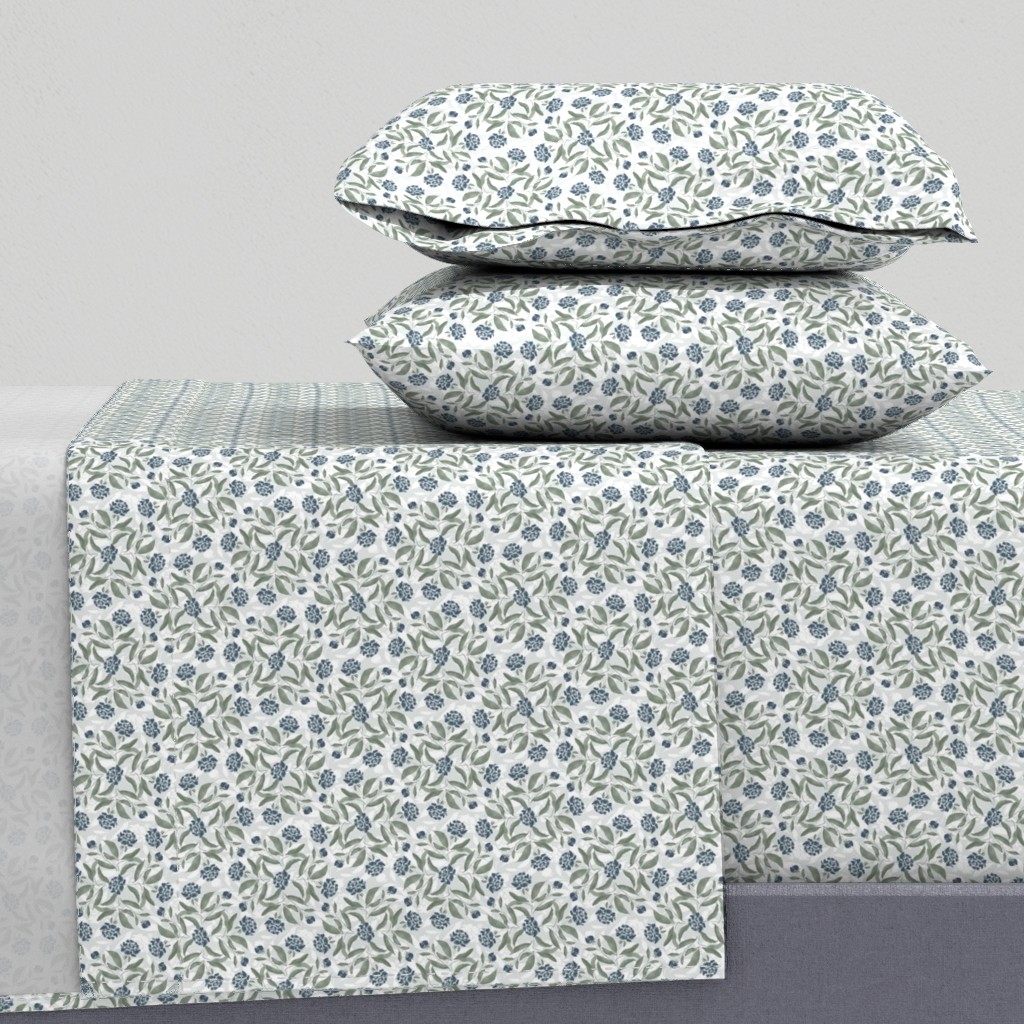 Side view of a bed with sheets and two pillowcases