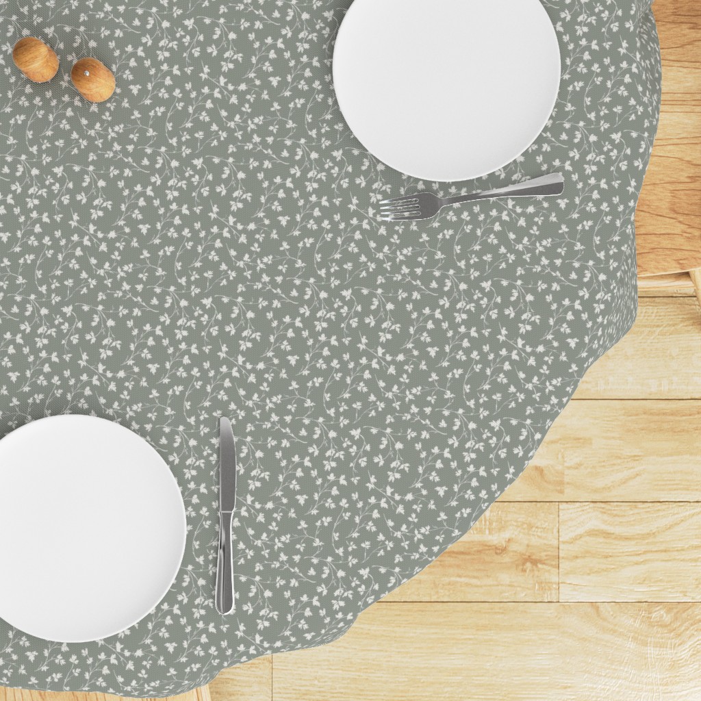 Top down edge of a round table with a Tablecloth draped on top