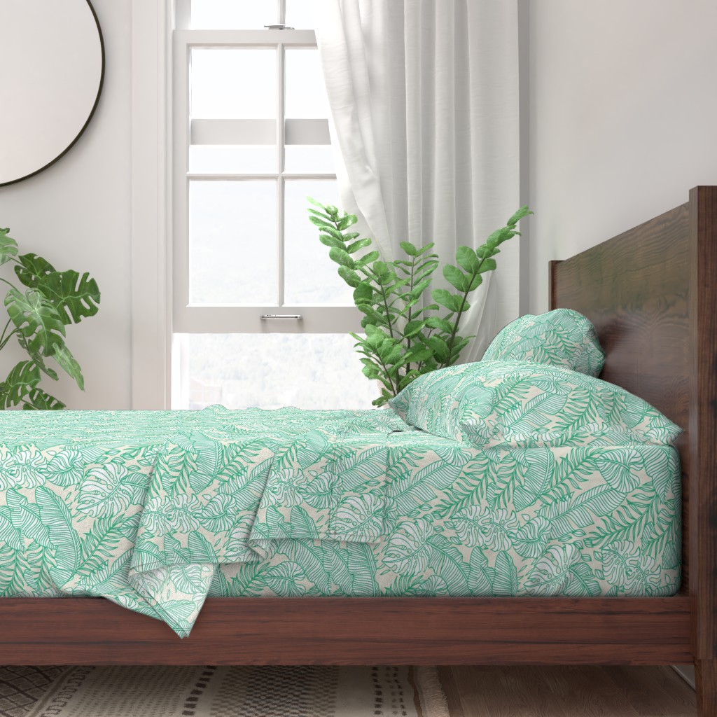 A neatly made bed with sheets and pillows with a wooden bedframe. The bed is next to a window with plants on either side and a round mirror hangs on the wall to the left of the window.