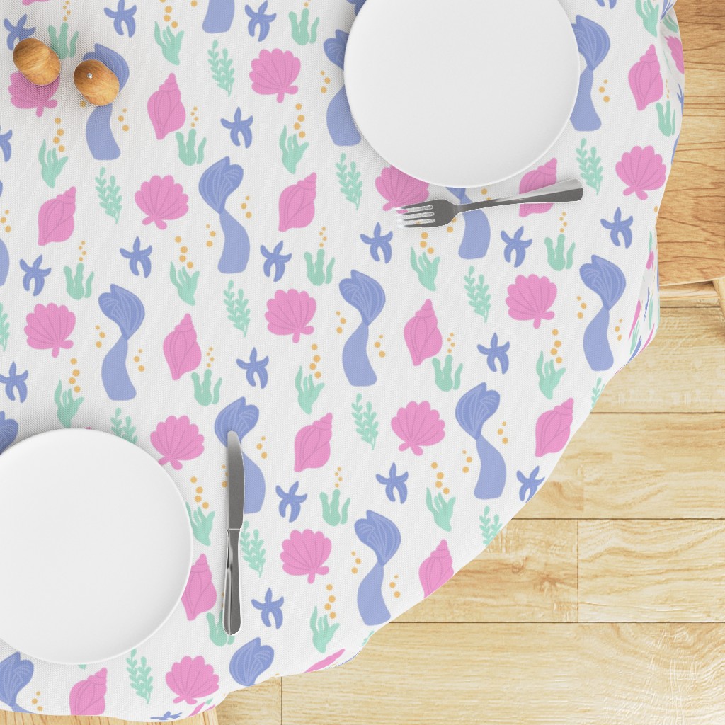 Top down edge of a round table with a Tablecloth draped on top