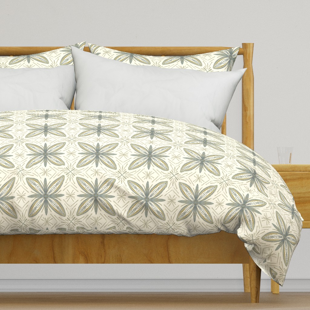 Light colored wooden bed frame with a duvet cover