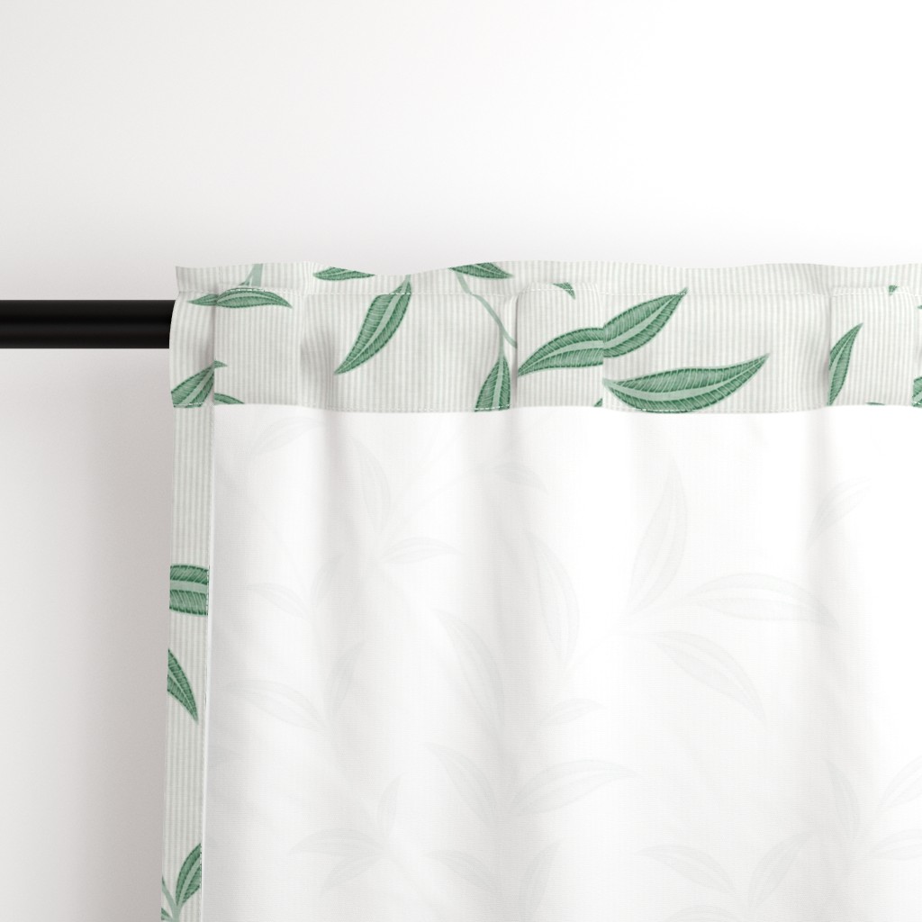 Close up of the back a Curtain panel hanging from a black curtain rod showing the rod pocket hanging option