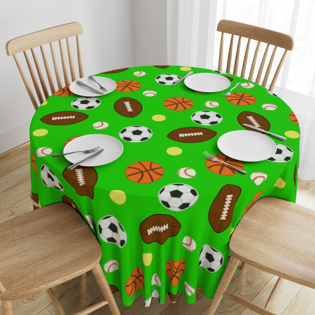 Top down angeled view of a wooden table with a 90 inch Round Tablecloth and four place settings arranged on top