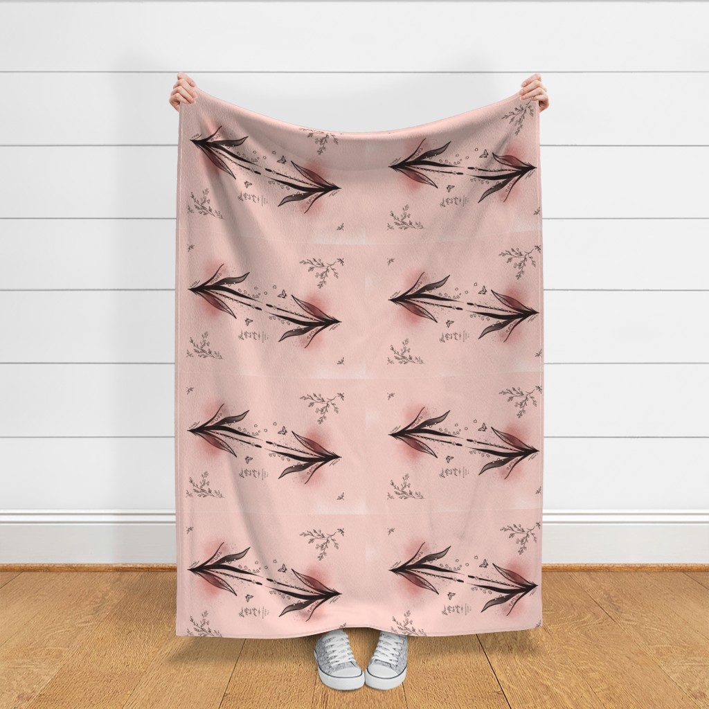 Throw blanket held up in front of a white shiplap wall