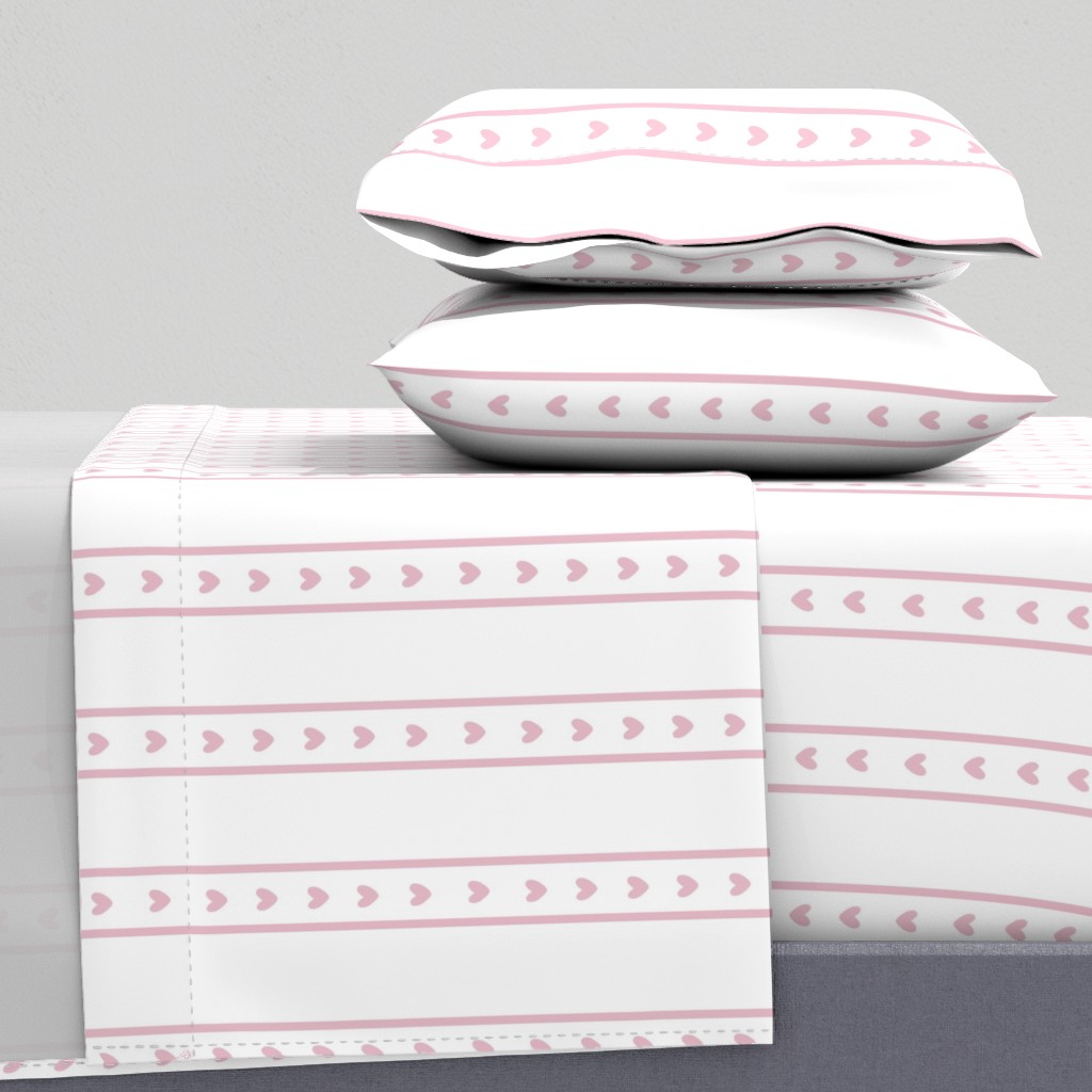 Side view of a bed with sheets and two pillowcases