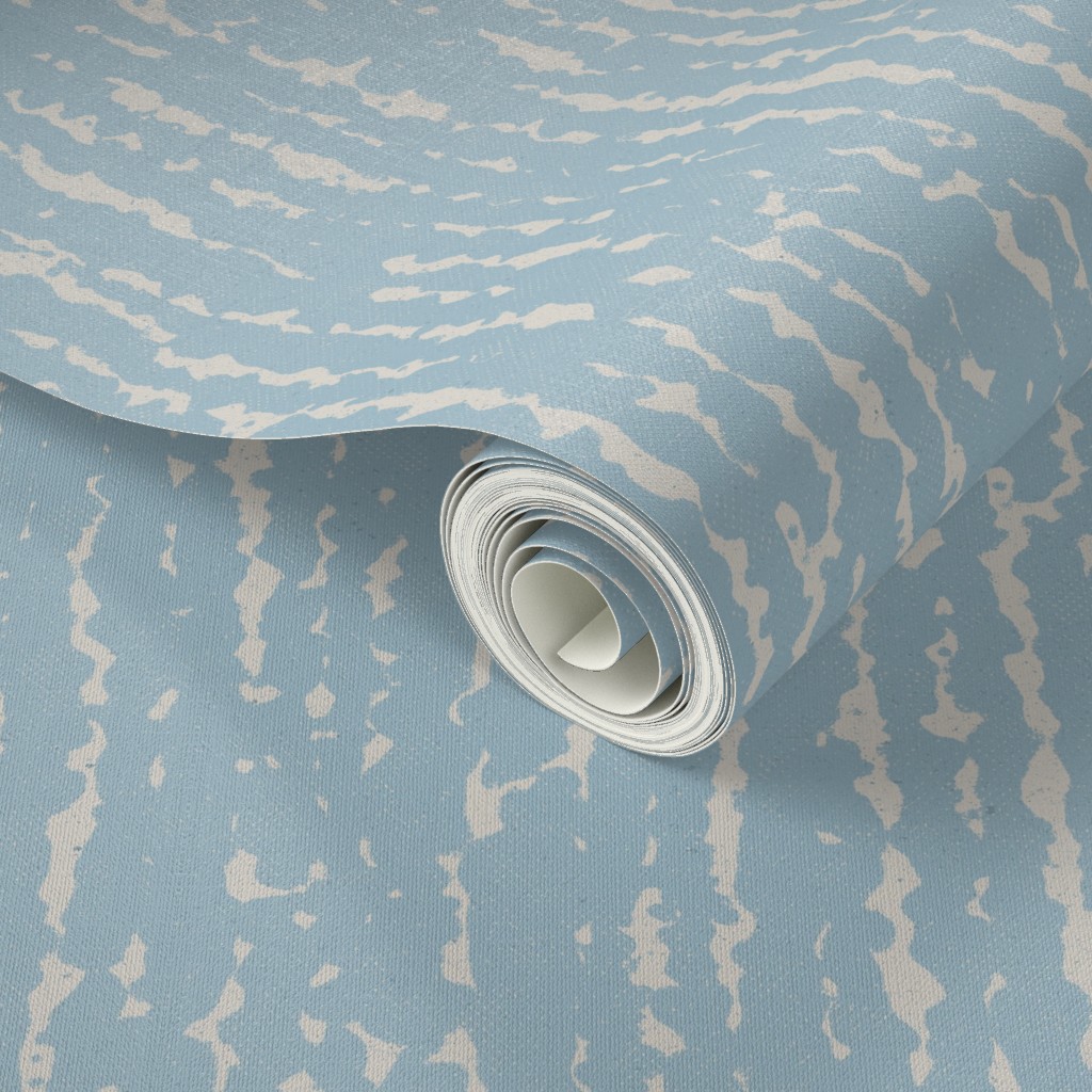 Close up of a Peel and Stick wallpaper roll with a design applied