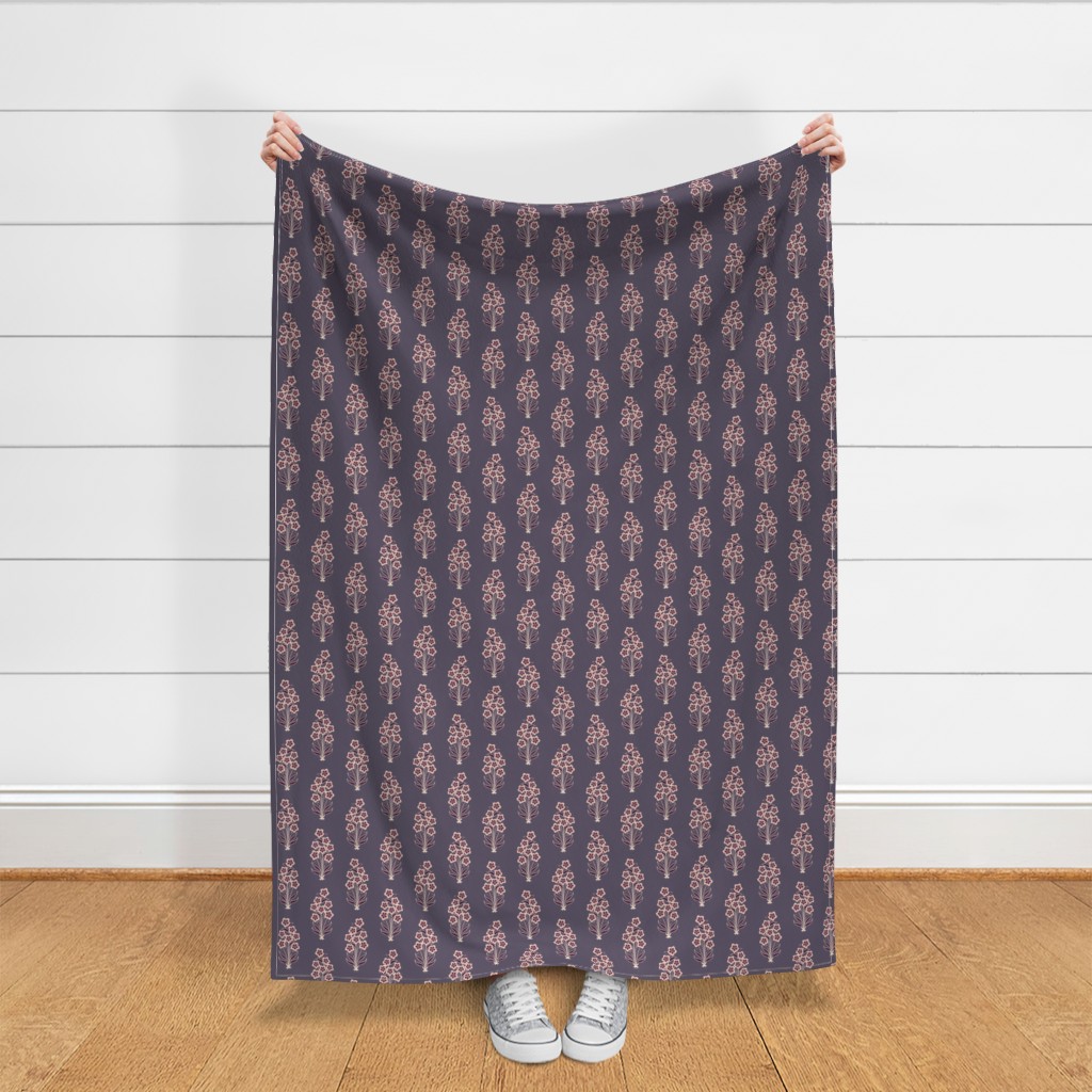 Throw blanket held up in front of a white shiplap wall
