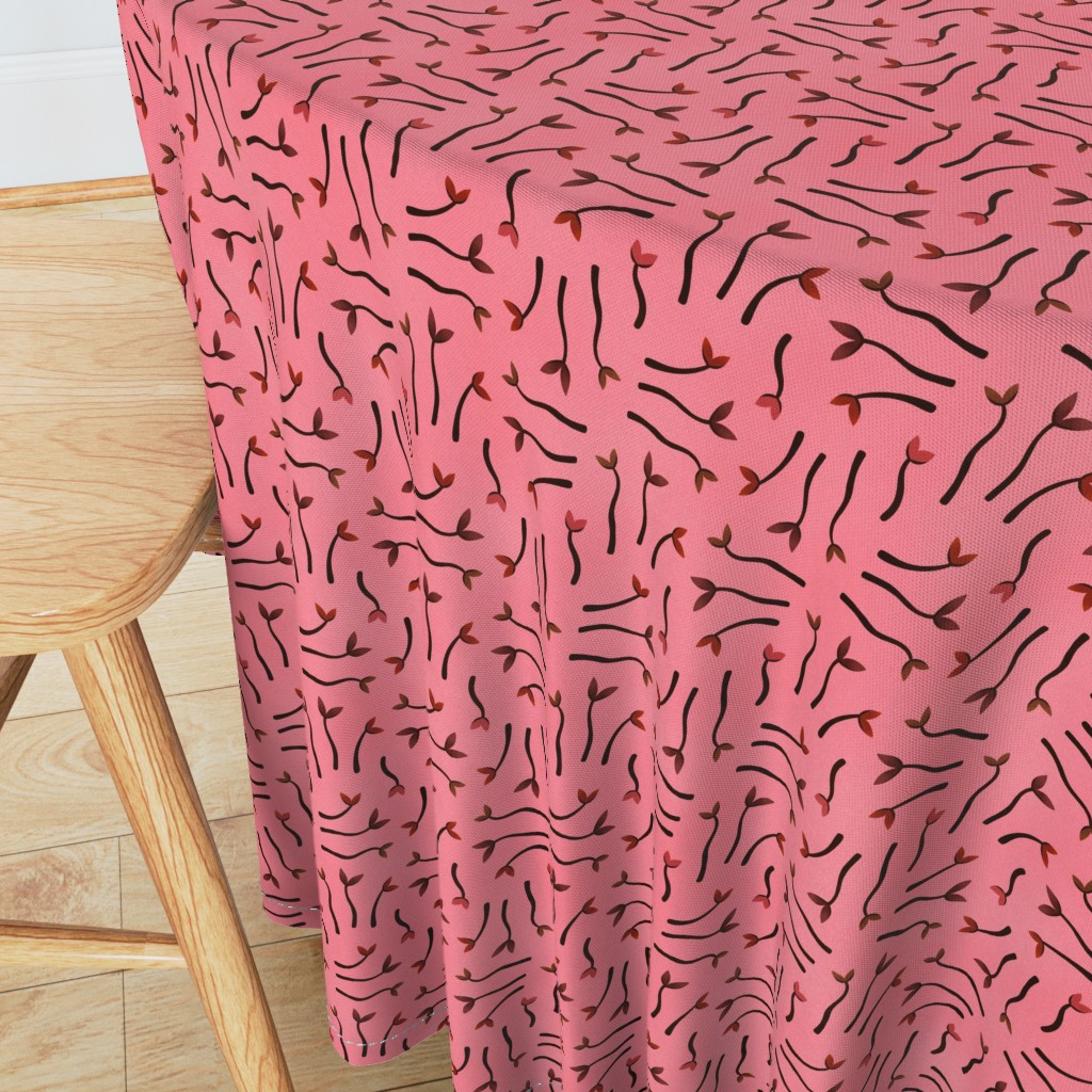 Angeled side view of a round table with wooden chair in the foreground and a 90 inch Tablecloth draped over the edge showing the sewn hem around the edge