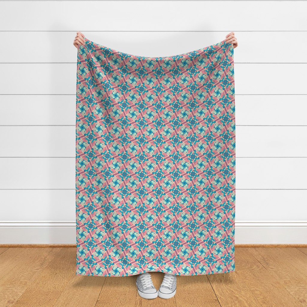 Throw blanket held up in front of a white shiplap wall