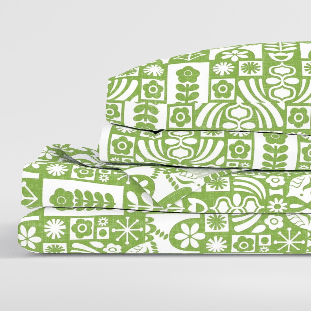 Side view of a folded stack of sheets with two pillowcases