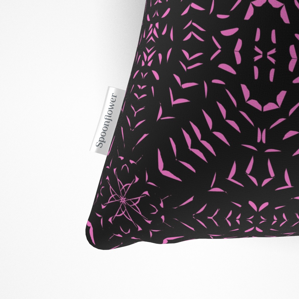 Close up of the Spoonflower tag on the side seam of the Throw Pillow